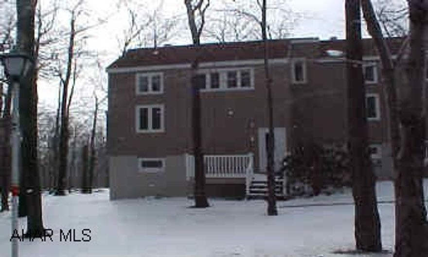 Updated condo - 1st Floor Unit - New siding, windows, carpet, pergo floor, gas fireplace - Rental info available - Sleeps 6 - Assoc Dues $334.40 Super 1st Floor Unit - End Unit - Non Smoking - with patio appliances, some furnishings, satellite, right on hole #9 of Golf Course, Cross Country ski trail.  Guests may use tennis courts, sauna, jacuzzis & swimming pools.