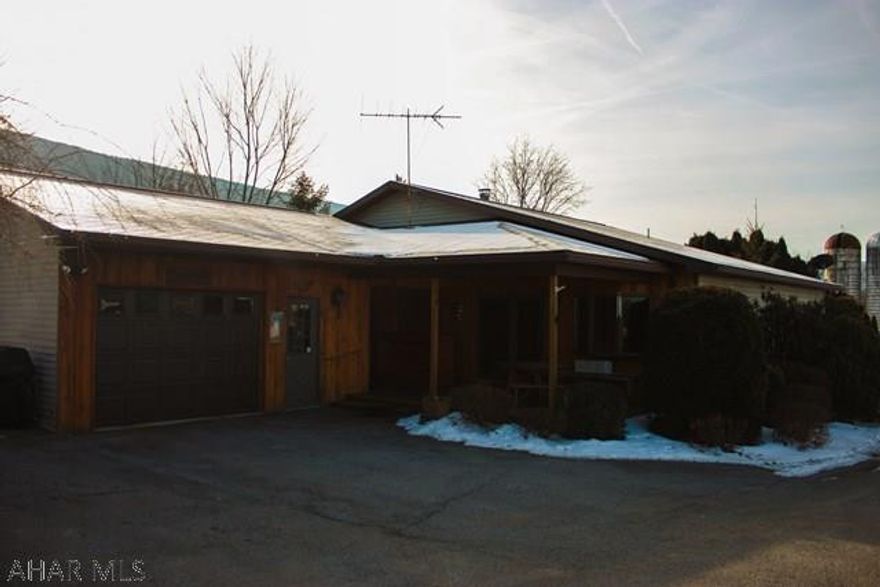 3BR/2.5BA Ranch in Bellwood-Antis School District!! This home is nestled away from the hustle & bustle and surrounded by pure quietness. This home is a must see offering an open floor plan, Living room & Dining room including cathedral ceilings with beams and knotty pine walls. Kitchen has updated Lakeview Cabinets, an Island, Breakfast bar and an Eat-In area. Master Bedroom with 2 walk-in closets and own bathroom. Bedroom #2 spacious with access to main Full Bath, Laundry on main floor along with access to the Half Bath. Don't forget the oversize 1-car Garage with storage and workbench.