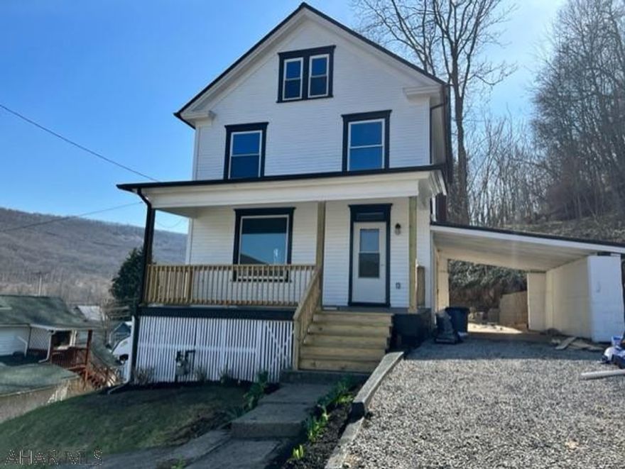 Fully renovated 3 bedroom, 1.5 Bathroom.  New kitchen with new appliances.  Two new bathrooms.  1st floor laundry with new washer and dryer.  New metal roof.  All new windows.  Three updated decks and porches.  Includes a carport.  Includes a new concrete patio with new retaining wall.  All new electrical.  A lot of updated plumbing.  All new carpet.  Refinished hard wood floors.