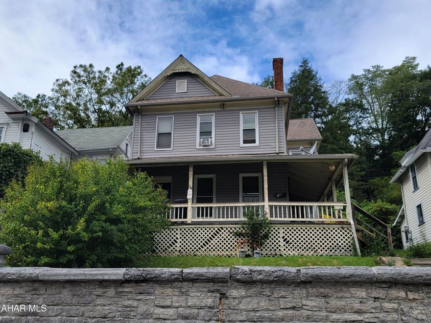2 1/2 story, 4 bedroom home with 2 full baths. Vinyl siding, shingle roof. Wrap around front porch. 2 furnaces and 2 hot water heaters. Property had previously been a duplex but was converted to a single family dwelling. Needs some TLC.