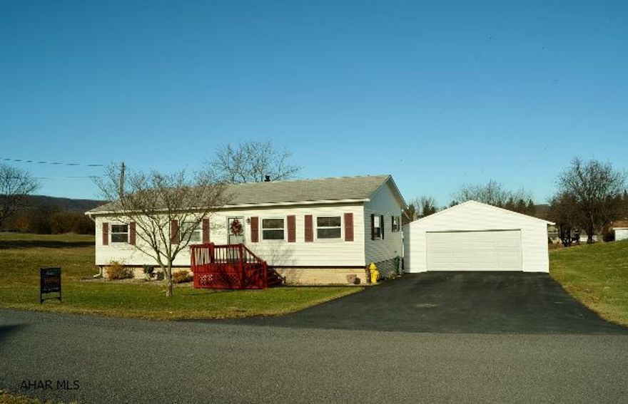 Great starter home on the outskirts of Everett (Sponsler Development).  Nice level lot. A very clean home with a nice flow to it.  Large covered deck for summer entertaining. Large double garage & paved driveway.  This home has a new permanent framed raised roof, new siding, windows & a permanent foundation.