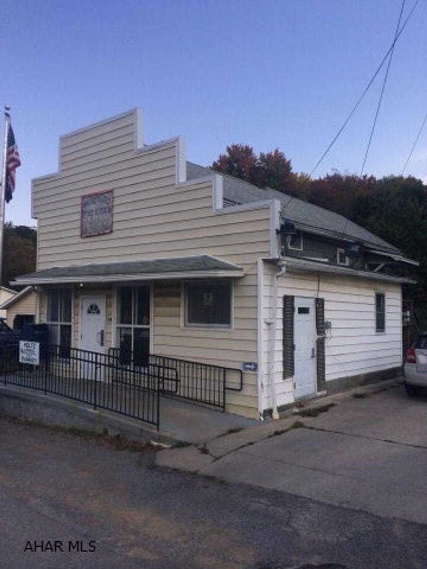 Post office rental on 1st floor, new 5 year lease with tenant paying elect - 2nd floor apartment with living room, kitchen, bedroom and bath. Yearly gross rental income is $7,700.  Separate electric. Owner pays, water and sewer - total approx. New electric baseboard heat in both units.