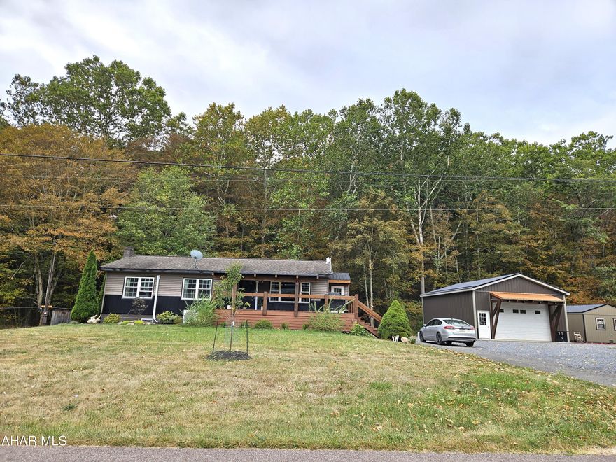 Attention buyers!  Are you tired of looking at houses that are advertised as ''move-in ready'' and they still need work?  Come have a look at this gem.  Nestled in a rural setting, this raised ranch home was gutted to the studs in 2023 and tastefully renovated.  It offers the perfect blend of modern comfort and countryside charm.  You will love the craftsmanship and care taken to make this house a home.  As you enter the front door, the oak flooring grabs your eye.  The exposed beam, tongue & groove pine ceiling with recessed LED lighting is sure to please.  As you step into the dining room, you'll be pleased with the open layout to the kitchen.  New luxury vinyl plank flooring leads you to a kitchen that features custom hickory base cabinets topped with a quartz contertop.  The upper maple cabinets contrast perfectly with the hickory base.  Throw in a corian farmer's sink and you have a kitchen that most of your friends and family will be jealous of.  The bathroom features ceramic tile flooring and a granite vanity top.  Bedroom #1 features oak flooring, a large window and plenty of closet space.  The primary bedroom is carpeted with a T&G pine and drywall ceiling and LED lighting.  This bedroom also has a walk-in closet and an office area that has luxury vinyl plank flooring.  The new windows flood the house with natural light.  Two mini-split heat pumps keep the home at a comfortable level all year long.  There is a wood stove in the basement for back up heat. The backyard is an entertainer's dream, with a lighted patio perfect for relaxing or hosting family and  friends. Complete with a firepit, it offers the ideal spot to unwind under the stars while sitting next to Wolf Camp Run. If garages are important, you will be impressed with the oversized two- car garage that offers plenty of storage space, has new metal siding, a new metal roof, a concrete floor, electricity, water and a propane wall heater.  This home combines modern convenience in a serene setting.  Whether you're looking to enjoy quiet evenings or exploring the surrounding area, this charming property has it all.  Conveniently located between Bedford, PA and Cumberland, Maryland, it is a perfect location to enjoy all that Bedford County and western Maryland have to offer.  It is approximately 2 hours from Pittsburgh and 2-1/2 hours from DC and Baltimore. Property is under contract with the right to continue marketing and a -hour kickout clause.