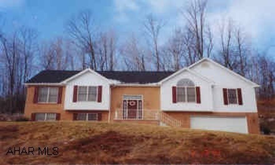 OVERSIZED BI-LEVEL, VAULTED CEILING IN LIVING ROOM, 2 FAMILY ROOMS WITH FIREPLACES, LOVELY OAK EAT-IN KITCHEN.