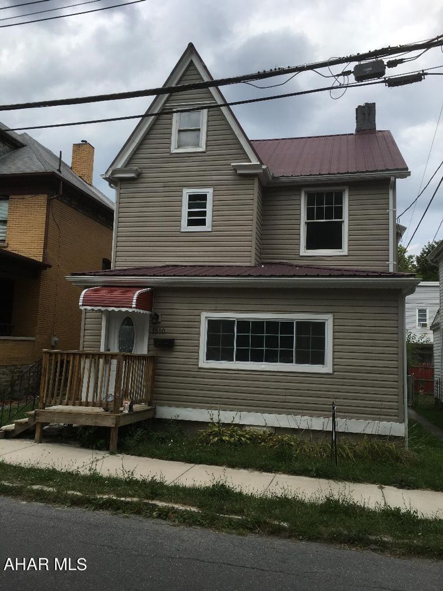 Completely remodeled 2 story 3 possible 4 bedroom home. New electric service, new drywall, new windows, new flooring, new siding, with a newer metal roof. Home will be ready to move in  on a 35 x 120 level lot.