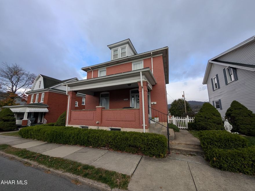 Spacious 2-story brick home in Altoona's desirable Garfield Park neighborhood! This charming residence offers 4 bedrooms, 1.5 baths, along with a beautiful entry foyer, bright formal living room and dining room—perfect for entertaining. The fully equipped eat-in kitchen features solid surface countertops, large pantry and plenty of workspace. The finished walk-out basement adds even more living area, including a cozy family room with gas fireplace, half bath, laundry, and utility room. Enjoy beautiful mountain views from the large covered rear deck, or relax on the inviting covered front porch. Fenced yard with rear alley for possible off-street parking. Ample storage in walk-up attic. Schedule your tour now!