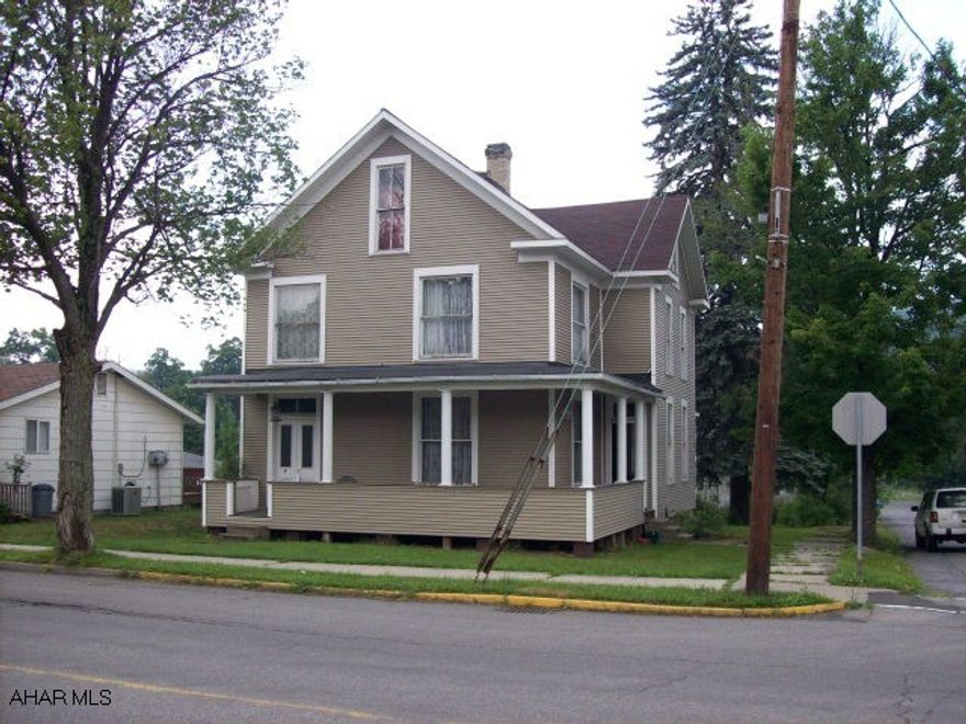 Large spacious Victorian style home, attic has 3 rooms that could be additional bedrooms.  Home has lots of potential but is being sold as is.  Shale driveway. Large corner lot.