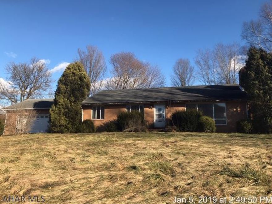 Lots of potential with this large brick ranch.  Nice size rooms with big closets.  Big lot with mature trees.  Close to state game lands #41.    Oil hot water heat & central air conditioning,   Fireplace in living room and basement. As Is Sale.  Buyer is responsible for any repairs/replacement that may be necessary to the septic system.  Call agent for details.