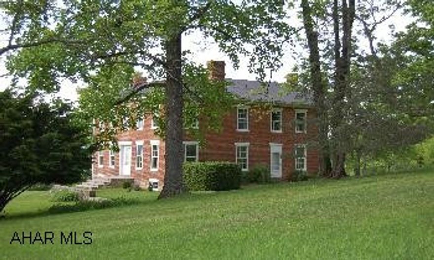 60 acres hay & grass, 80 acres mature forest, 4 acres lawn. Restored home with work fireplaces, wide plank floors, Fruit trees & hardwood trees, hunting, fishing, stocked pond. Beautiful restored brick 1860's home with 2 porches, screened sitting porch. Brick wrap around patio on 144 acres with large stocked pond, 8 stall horse barn. Smaller log barn, paddocks, hayfields, wood & 2 large springs. over quarter mile road frontage. Home is very private & secluded.