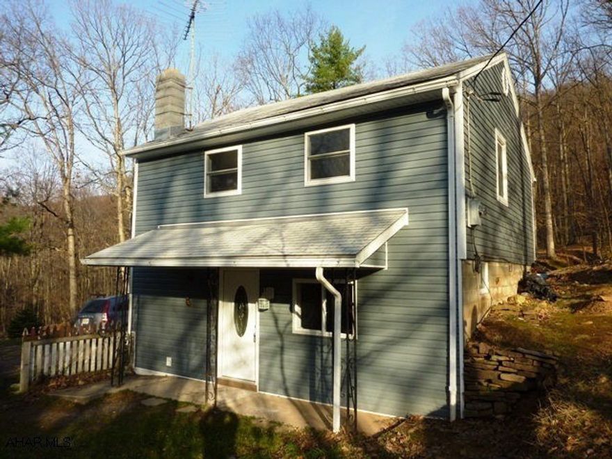 If you're looking for privacy, this is it!  Nestled in the woods, this quiet location offers a completely remodeled home.  Each bedroom offers closets, the eat-in kitchen includes appliances with convection oven.  Stream discharge system to be installed as soon as weather permits.  All of this on 1.7 acres!