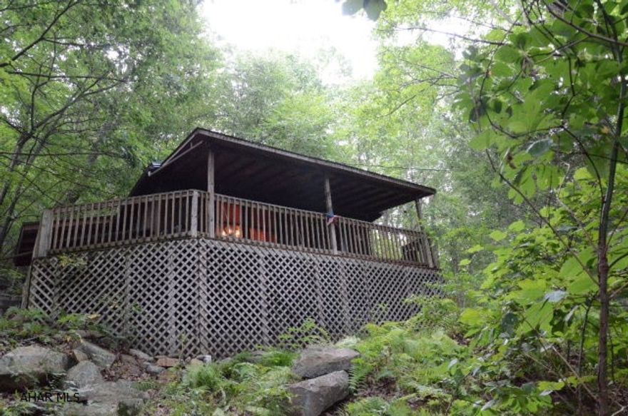 Hunters Delight!!!  Cute & Cozy private cabin with vaulted ceilings sitting on 10.4 wooded acres, part of 600 acres of hunting ground which also borders Black log creek. Property is 15 minutes to local stores and eateries. Cabin features an L-shaped deck to sit and enjoy peaceful evenings, sleeps 8 comfortably, furnished thru out and ready for new hunters. Motivated sellers!