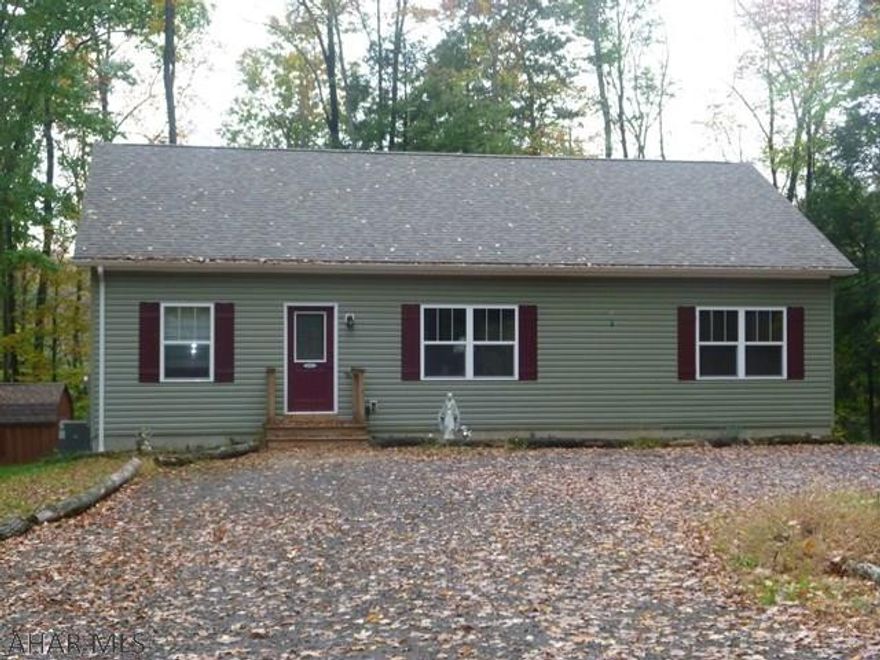 Nearly new home on over an acre surrounded by woods in a gated community.  Enjoy being out in nature but with all of the perks of a community.  One story home with three bedrooms and two full baths on the main floor, includes a master suite.  The kitchen was made for cooking, baking or just eating.  The large island has ample storage as well as a great work surface.  Since the kitchen is open into the living room and dining area it is a great space for family or entertaining.  Full bath and laundry are in the spacious basement but there are also laundry hookups on the first floor.  Heat pump supplies you with both heat and central air. This home is located in Glendale Yearound, a gated recreational community adjacent to Prince Gallitzin State Park / Glendale Lake and State Game Lands 108.