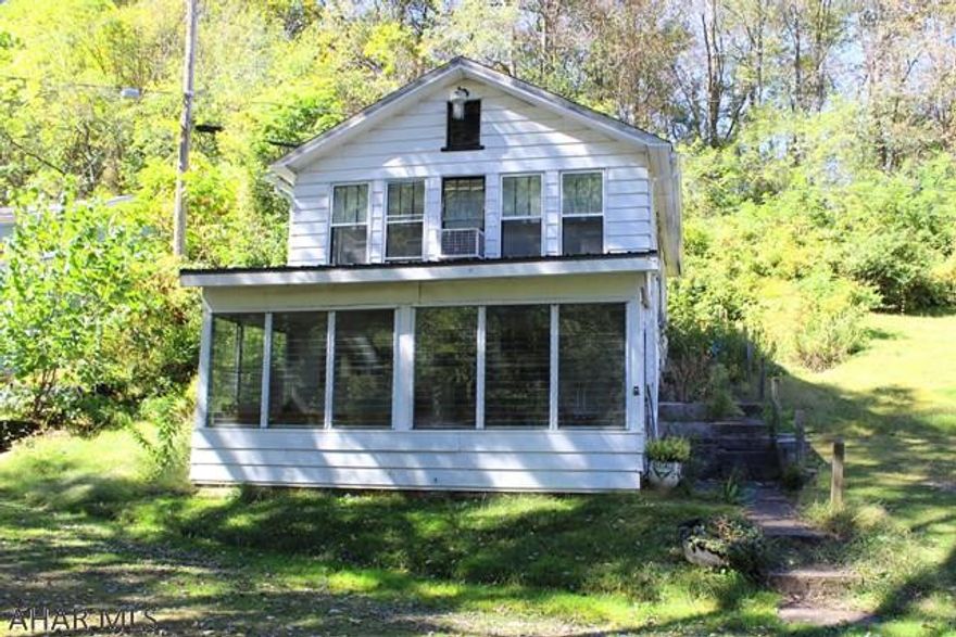 Quaint, peaceful cabin located on the bank of the Juanita River. This home features an updated kitchen with an eat-in dining area, two bedrooms and one bathroom. Enjoy a beautiful view of the river from your living room or stay cozy in the lower level near the wood burning fire place. The first level also features a sunroom with a wall of windows to allow a scenic river view. Call today for your showing!