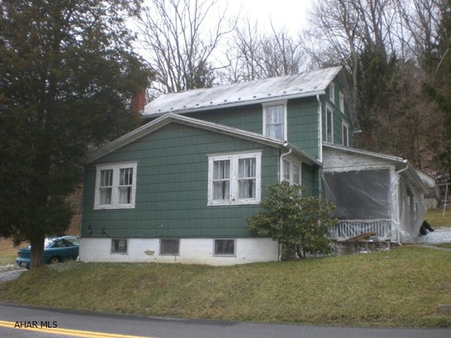 2-story house resting on 3 acres. Kit, LR, DR, Enclosed porch, 1 bath and 2- Bedrooms. Newer hot water heater & 100-AMP electric. House needs some TLC. Tenant occupied by long term tenant- Rent $350.00 Month plus utilities.