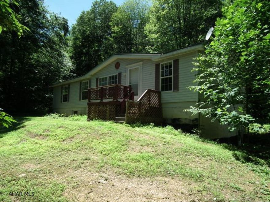 Sweet set up for those who love wooded areas. This 3 bedroom home sets on 7.6 acres of ground that is bordered by State Game Lands.