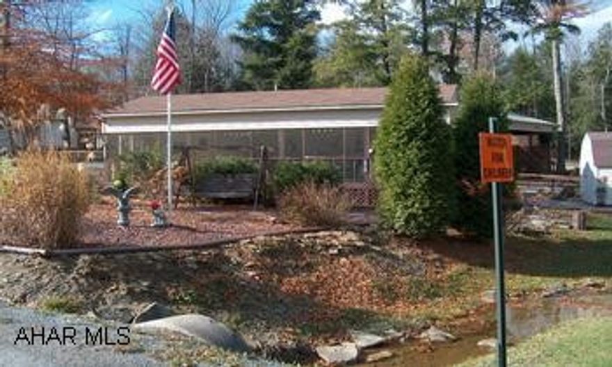 Gorgeous park model camper with two tip outs and front screened porch. Must be seen, this has everything to just start having fun--includes washer/ dryer. Can Be Used Year Round. Gated Community