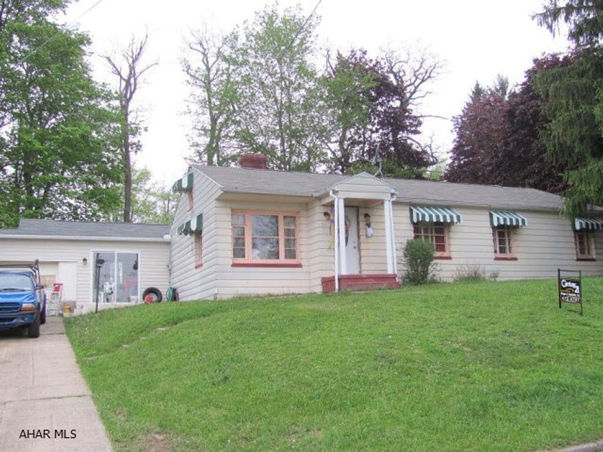 Ebensburg- Nice ranch home on a corner lot w/ mature trees & 1 car garage. fireplace, breezeway, family room, new laminate & tile floors, new bathroom sink & commode, new light fixtures, & painted interior.