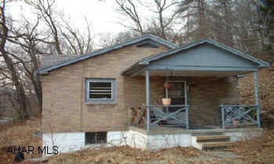 Brick Bungalo in need of remodeling. Big lot. Call office for showing instructions.