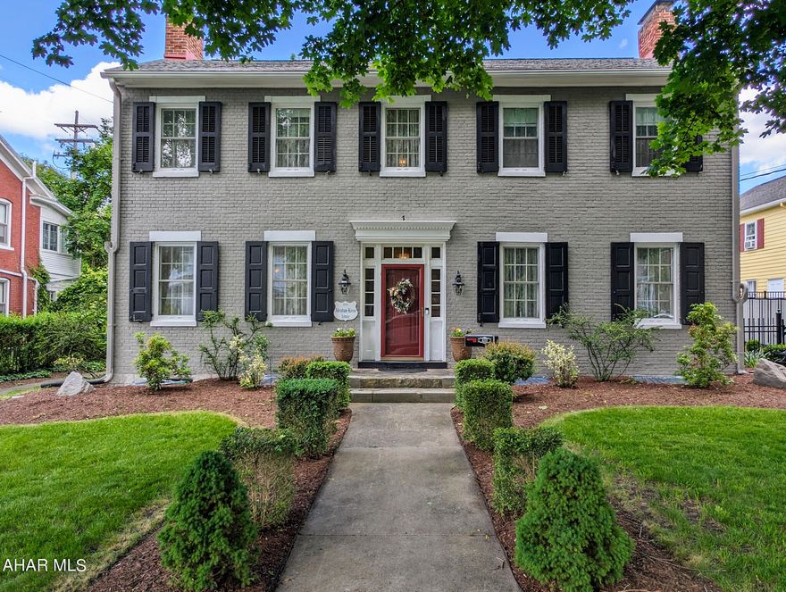 Breathtaking Colonial Home in Historic Bedford. So many things to appreciate in this lovely 1834 brick home! Sellers have remodeled and made so many updates! Newly remodeled kitchen with top of the line appliances, quartz countertops, and center island that opens to the inviting family room. Front formal living room has original crystal chandelier and marble fireplace. Formal dining room with crystal chandelier. Main level has a half bath. Front staircase leads upstairs to 2 large bedrooms, a 'Hollywood' master closet, and gorgeous bathroom with clawfoot tub, walk-in shower, and separate water closet. The laundry room is conveniently located upstairs.  A third bedroom has a full bathroom. Potential in-law apartment with separate staircase in the rear that includes a downstairs living room and upstairs 5th bedroom. Newly completed mudroom in rear. Upper porch overlooks the one-of-a-kind courtyard. Speaking of courtyards, this one will have you doing a double take! Relax in the covered hot tub surrounded by lush turf and a breathtaking waterfall. History is apparent with an original, detached two-story summer kitchen in the courtyard.   Partially fenced large back yard with a cement patio. The yard extends to the rear alley where there is off street parking for six cars and a one-car garage. Must tour to appreciate!
*OPEN HOUSE SATURDAY, SEPTEMBER 28th from 10:30- 12:00.