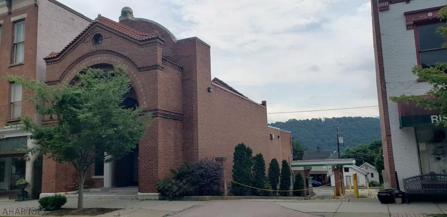 Beautiful brick building in the heart of Hollidaysburg.  This commerical building can be used for so many different options and most recently was used as a bank with 2 drive up windows.  The structrual integrity has been well maintained and is waiting on a new owner to come open up the doors again. Currently there is a walk in vault, secuirty system, teller stations, drive up window,  kitchen,  bathrooms, storage rooms, office rooms and more! Call listing agent for more information or your private tour today.