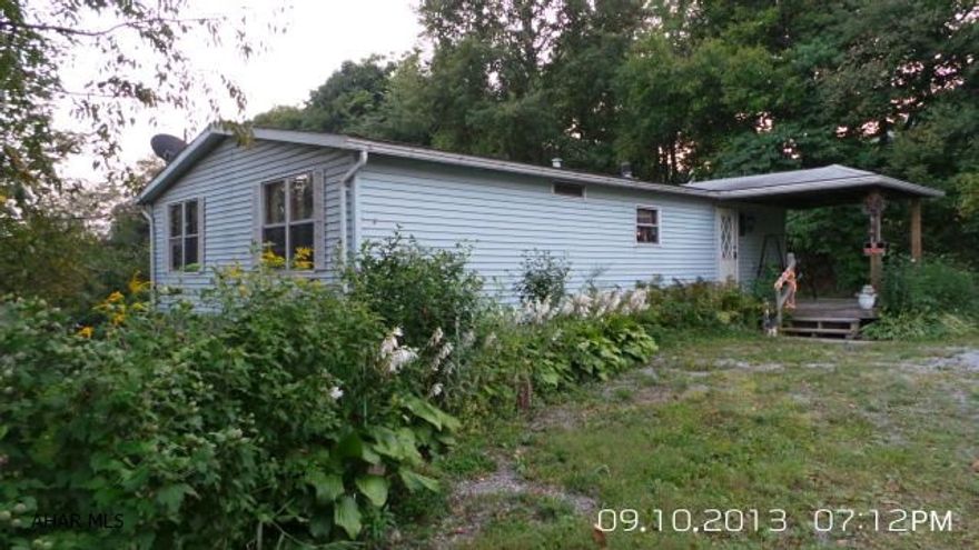 Private setting for this remodeled 44 x 28 doublewide on 1.46 acres.