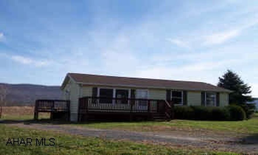Nicely remodeled ranch home on one acre with new kitchen, carpeting, and freshly painted interior