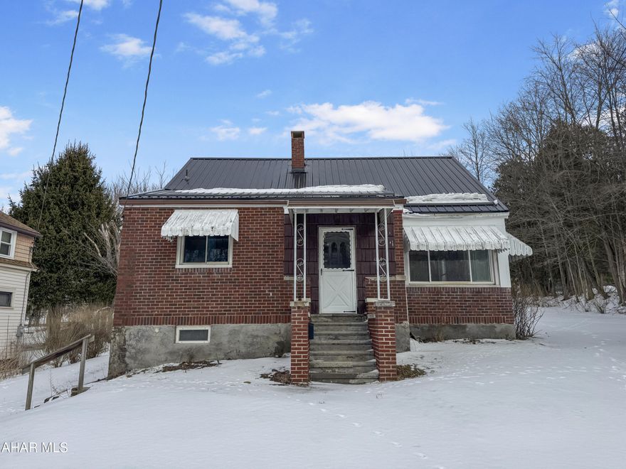 Welcome to 1813 Springhill Road in Portage Township! This stunning ranch home boasts a recently updated metal roof, a newer natural gas hot water furnace, & a state-of-the-art tankless hot water heater, among many other features. Upon entering the main floor, you'll be welcomed by a spacious living area that seamlessly connects to the dining room. The kitchen offers an abundance of cabinetry. You'll also find a convenient first-floor laundry/mudroom, two generously sized bedrooms, & an updated full bathroom. While the basement & attic are currently unfinished, they provide excellent potential for storage. Situated on a corner lot, this property includes a large yard, a shed for all your tools, & off-street parking for added convenience. Don't miss out on this wonderful opportunity. Call today to schedule a showing!