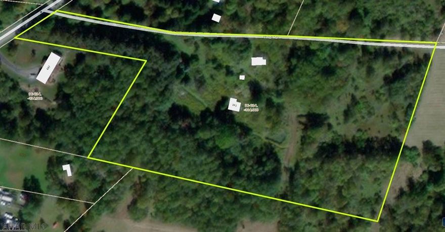 Eight partially wooded level acres approximately a mile from US Route 422 off Vic Miller Road allowing for an easy commute to either Ebensburg or Indiana.   For those hiking and bicycling enthusiast access to the Ghost Town Trail which stretches 46 miles connecting Indiana and Cambria counties.is located off Vic Miller Road approx. a mile from the property.  There are two wells (unknown age & condition) and two older sheds on the property.   Perc test approved.  Electric runs across the property. No recent survey of the property.