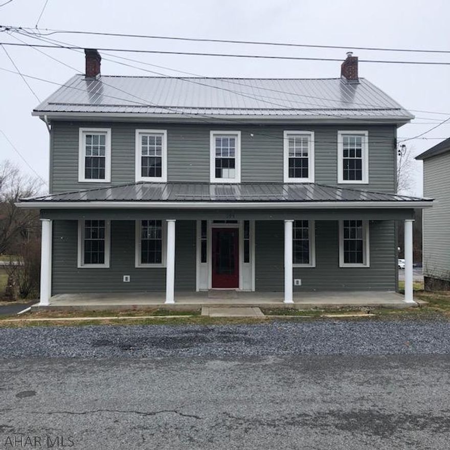 Nestled in the quaint village of Wolfsburg you'll find this spacious 2 story home that has been nicely upgraded. Walk in and be greeted by the original staircase and views to the open concept kitchen/Dining area that has loads of room to enjoy cooking and socializing. A large living room w/fireplace, oversized bonus room and first floor laundry add to the possibilities of this home. The second floor has 3 bedrooms and an upgraded spacious full bath and a large covered rear porch. New siding, new metal roof, new plumbing, upgraded wiring, new windows, new flooring throughout and new furnace are what makes this home move-in ready. Schedule your showing today!