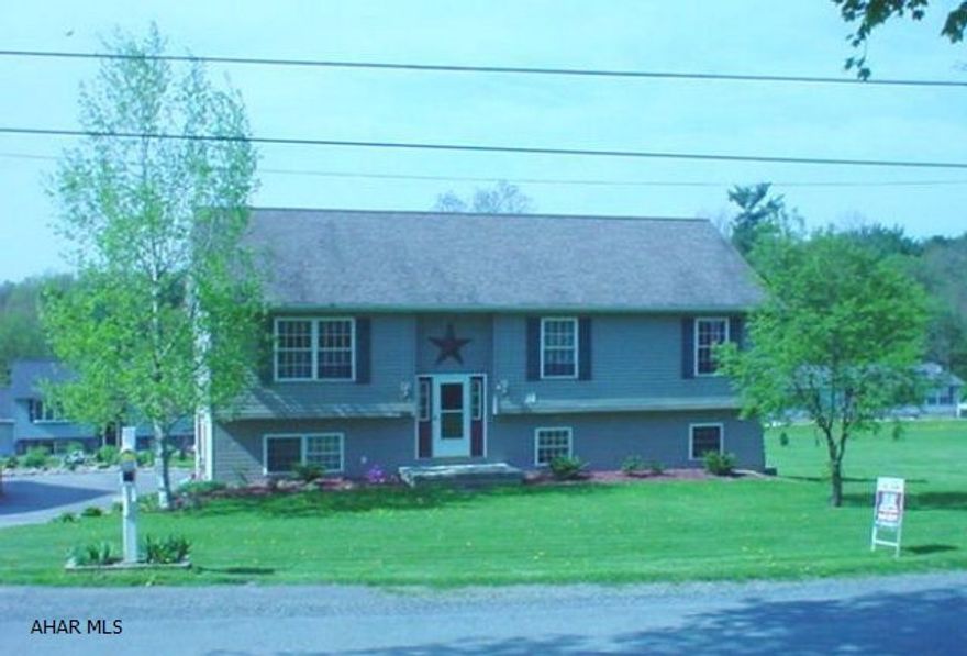 Impeccable bi-level with a large covered deck (can be closed). Family room with pellet stove and half bath.