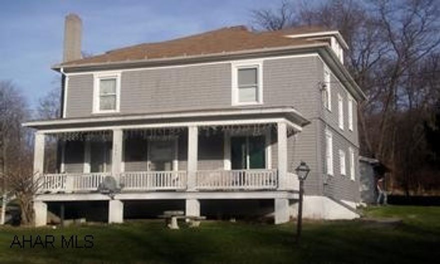 2-Story cedar shakes/wood lap siding, 2 car garage. Address is 15 Lincoln Street, Robertsdale, PA 16674 2-Story home in a quiet, pleasant neighborhood. Exterior is cedar shakes and wood lap siding, freshly painted. Newly remodeled bathroom with ceramic tile and whirlpool tub. New windows and doors. Move in condition.