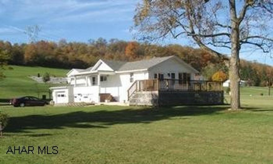 Country living in a convenient location. 1 story vinyl home with 2 BR on 0.4 acre. Hardwood floor in MBR & under carpet in LR. Lots of updates: new roof, windows, mechanics, & deck. Relax on the covered porch or have a cookout on the fantastic deck. Country living in a convenient location. 1 story vinyl home with 2 BR on 0.4 acre. Hardwood floor in MBR & under carpet in LR. Lots of updates: new roof, windows, mechanics, & deck. Relax on the covered porch or have a cookout on the fantastic deck. City water, yet well on property available for use.