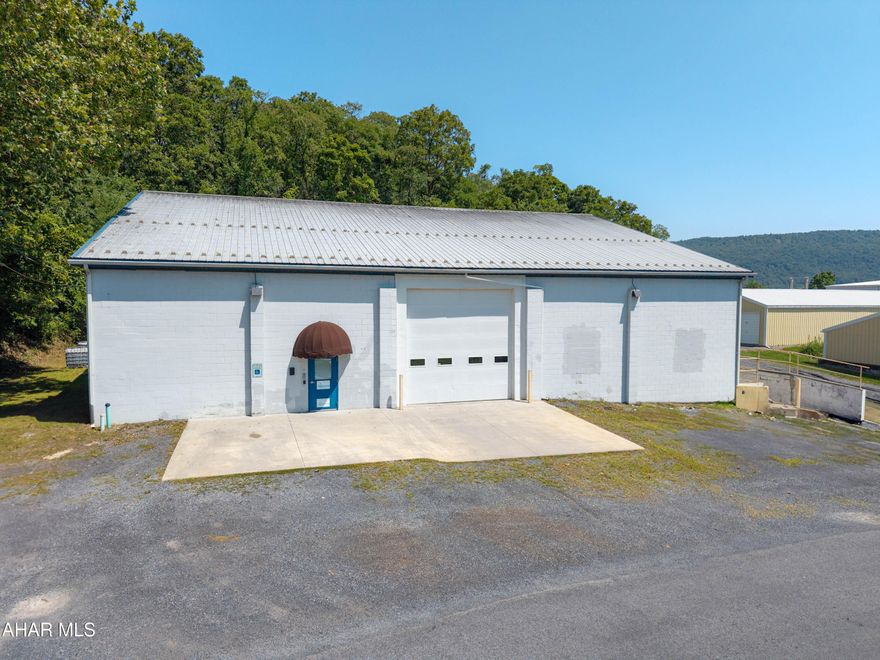 This is a rare find!! Warehouse building with office space situated just outside the Bedford Borough!! Building contains 7,240 square feet with two ground level overhead doors and one truck loading dock. Warehouse space is heated with zoned natural gas furnaces. Office space is heated and also has cental air conditioning. ADA accessible, three phase electric, and public water and sewer. Great for warehousing, manufacturing, retail business, office space, art gallery, winery, brewery, repair garage or vehicle storage. Located in Bedford Township with no zoning, this building has many uses. Off-street parking in front and also the rear of the building. Convenient location close to the downtown Bedford area, major roads, and other amenities.