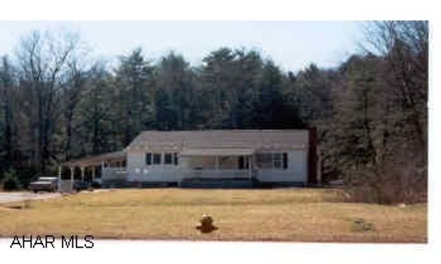 I-99 N to end; continue straight at light at Snappy's onto 350N; home on left. Living room has hardwood floors and a fireplace. Home needs some completion work. J-492