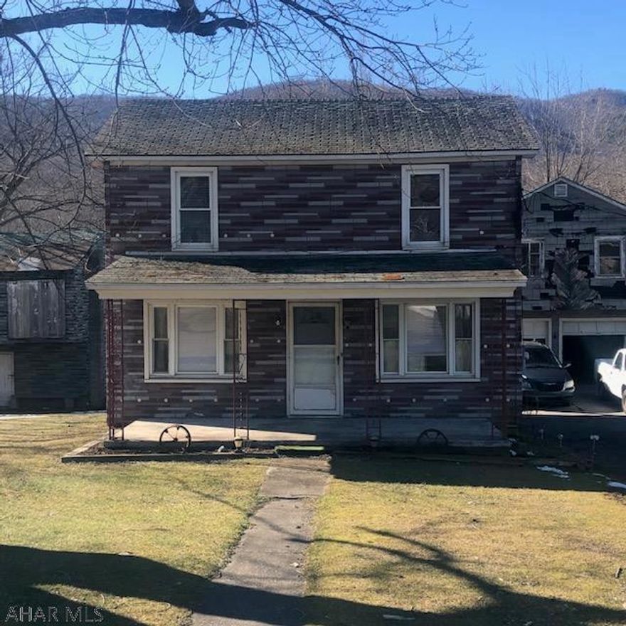 This fixer-upper is currently used as a rental property and is a great money maker - or - you could rehab it in to your very own home sweet home!  Being sold "As Is/Where Is".