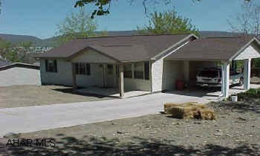New 3BR ranch next to Garfield Park. Large corner lot, living room with fireplace, and carport.