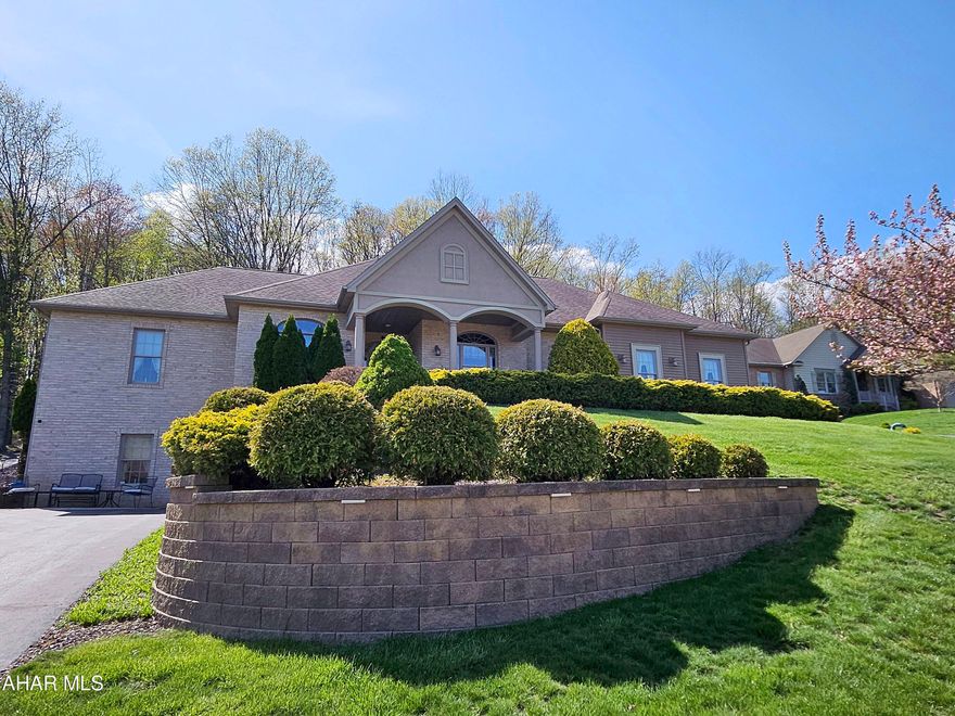 As you step into the 5,572-square-foot home at 169 Hollow Run Trail, you're greeted by custom glass front doors with elegant sidelights and a striking arch light above. The attention to detail is evident from the very beginning, with cherry crown molding and arch-topped doorways enhancing the entryway. This seamless introduction leads into a spacious and open floor plan, setting the tone for the rest of the home. This exquisite home, crafted by renowned builder Greg Dempsie, is a true testament to fine craftsmanship and thoughtful design. Every corner of the house reflects a high level of attention to detail, ensuring a sense of elegance and comfort throughout.
In the formal dining room, family and friends can enjoy meals in an atmosphere of spaciousness and charm. The room is bathed in warmth, with crown molding accentuating the 9-foot ceilings, and rich cherry hardwood floors that flow seamlessly throughout the space. A striking large arched window not only provides ample natural light but also mirrors the arched doorways found elsewhere in the home, each adorned with decorative ornamental rosettes that add a touch of classic beauty. This harmonious blend of design elements creates an inviting and refined space perfect for both everyday living and special occasions. This kitchen is a true masterpiece, designed to inspire and elevate every cooking experience. From the moment you step in, you're greeted by sleek, custom cabinetry that stretches to the ceiling, offering both style and ample storage. The countertops are a stunning granite, catching the light and creating a luxurious feel.
Upgraded appliances—think double ovens, a six-burner gas range, and a built-in fridge—make this kitchen perfect for those who love to cook and entertain. The large, center island is a showstopper, with plenty of prep space and a built-in sink for convenience, making meal prep a breeze.
Ample natural light pours in through large windows, illuminating the space and creating a welcoming, airy atmosphere. With thoughtful touches like under-cabinet lighting, a stylish backsplash, and a layout that seamlessly flows, this kitchen isn't just functional—it's a beautiful centerpiece of the home.
Just picture baking cookies with all that expansive counter space! This impressive walk-in pantry offers abundant storage and organization for all your culinary needs. With generous shelving and ample space, it's perfect for keeping dry goods, kitchen essentials, and small appliances neatly tucked away. The large layout ensures easy access to everything you need, while keeping your main kitchen countertops clutter-free. Ideal for busy families or avid cooks, this pantry enhances both convenience and functionality, providing a stylish yet practical solution for any home. This home exudes comfort and room.  Extra-wide hallways with large closets further enhance the sense of space and storage, making it feel even more expansive. This home is designed to offer both functionality and elegance, with plenty of room for you and your family to enjoy. A pocket door from the entryway opens to a wonderful flex space currently being used as an office because of the privacy it can offer.  The room is wonderfully lit naturally, but also offers a sleek modern ceiling fan light.
Expansive laundry room, designed for convenience and efficiency. Featuring ample space for washer and dryer hookups, this room also includes a utility sink. Plenty of built-in closets and cabinets provide abundant storage for linens, detergents, and cleaning supplies. This masterpiece home has so much more to offer - just come and tour this one of a kind home!