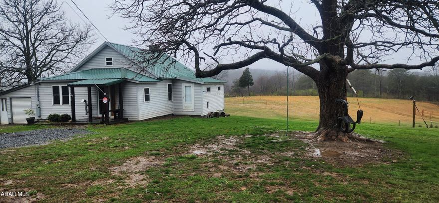 House with over 6 acres in Everett school district. 3 +car pole building with a lift and its own electric panel. Nice chicken coop and a shed all within a fenced in yard for all of your goats, chickens and horses.  If you are ready to have a hobby farm that is ready for you to bring your animals, then this is the place for you.  With a little paint and your own added touch this can be your dream home in beautiful Bedford County.  New electric panel box installed on 3/25/2024.  There are 2 wells on the property.  One for the house and one for the garage and outbuildings.  
Call today to have your dream become a reality.