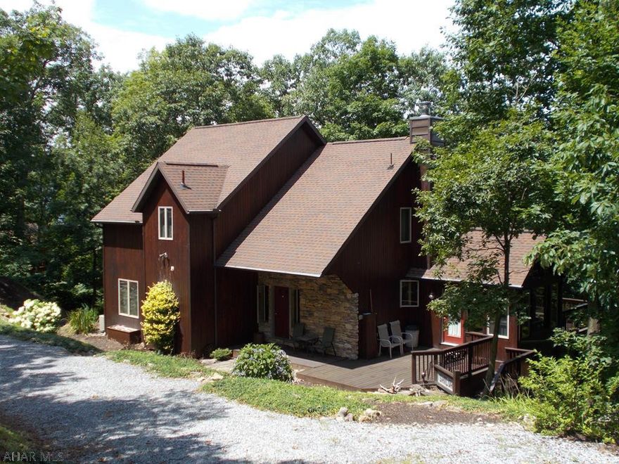 This home was custom built to be a second home.  Beautiful and private for use both summer and winter. The deck faces Tussey Mountain.  Check out the open concept living area  along with a first floor MBR and bath,beautiful sun room  and deck to take advantage of the surrounding woods.  Second floor has 3 large bedrooms, full bath and oversized loft overlooking the family  room.  A heat pump heats and cools to keep utility costs down . Partially finished basement with 3/4 bath, bonus room and woodstove.  Stunning does not even begin to describe this cedar home. Use it as a full time residence or a seasonal rental.