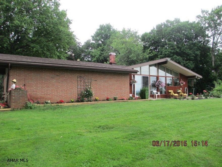Beautiful View for a Contemporary Brick/T111 Sprawling One Story Ranch home on Secluded 2.12 acre.Over 3000 sq. feet of living space.Five stall Horse Barn and tack room with 2nd story loft for Hay Storage. Partially fenced for Horses.  Storage shed approx 12' x 16'. Cathedral ceilings, Wrap Deck. Inground pool (approx 20' x 40') with Koi and Goldfish Lilly Pond.  Walk-in pantry in Kitchen. Fireplace has pellet stove in Living Room. 2 car garage with 200 amp breaker box. Cistern in garage (UV light in Kitchen), Two Septic systems with drainage systems rebuilt. A meditation court yard..  All bedrooms have lighted walk-in closets and doors to outside.  Wrap around deck.Storage closet in rear of home.Crawl space approx 6 courses of block.  Taxes with a discount is $4624