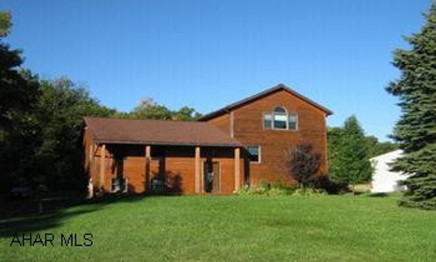 Beautiful contemporary home with fabulous family room addition with stone fireplace. Large rear deck. Country living at its best. Property located on Wopsy just 4 miles from Altoona Camous of PSU!