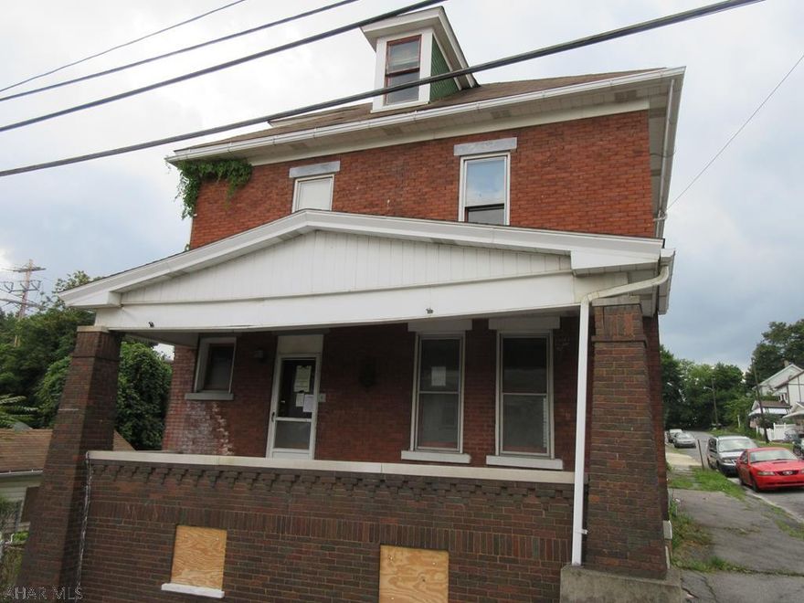 Altoona 2.5 story brick in need of TLC. Large wood deck off rear, fenced yard, finished attic and 1 car detached garage. AS-IS sale. Seller will make no repairs.