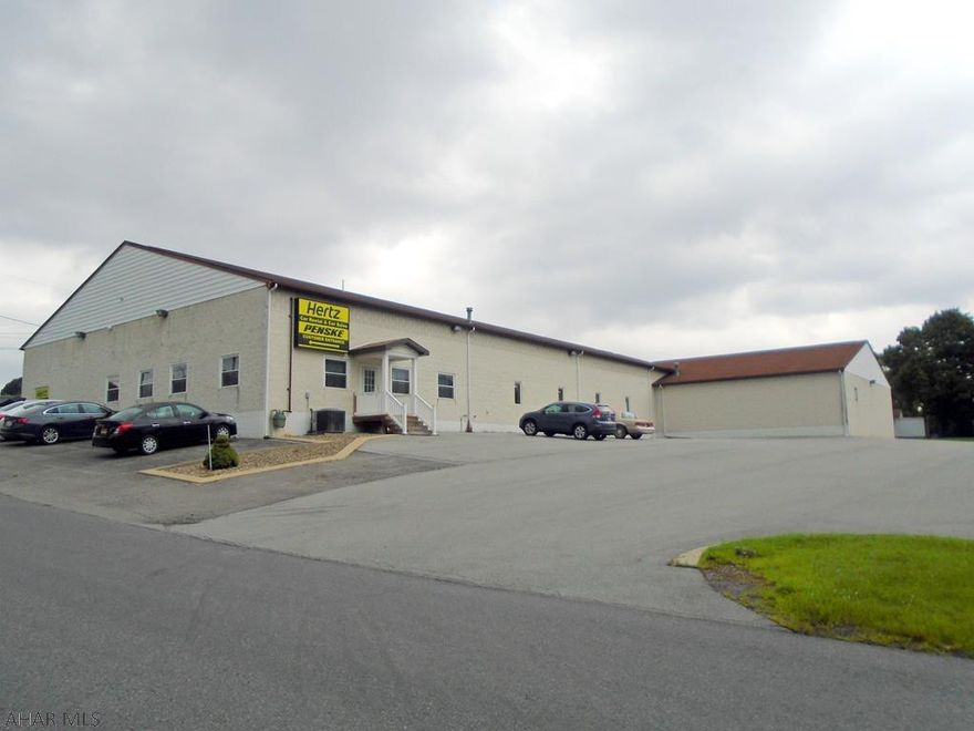 Many Possibilities. 12,000 sq ft building. 3 overhead garage doors at grade level. Large showroom with radiant floor heat. Private office with personal restroom off showroom. 6 more offices. Large conference room with beautiful woodwork. Reception area. Two sets of men's and women's restrooms. Lunch room area. Tons of parking!! Two additional parcels that front Pleasant Valley Blvd. Minutes away from access to I-99. Currently leased. Call listing agent for your personal tour.