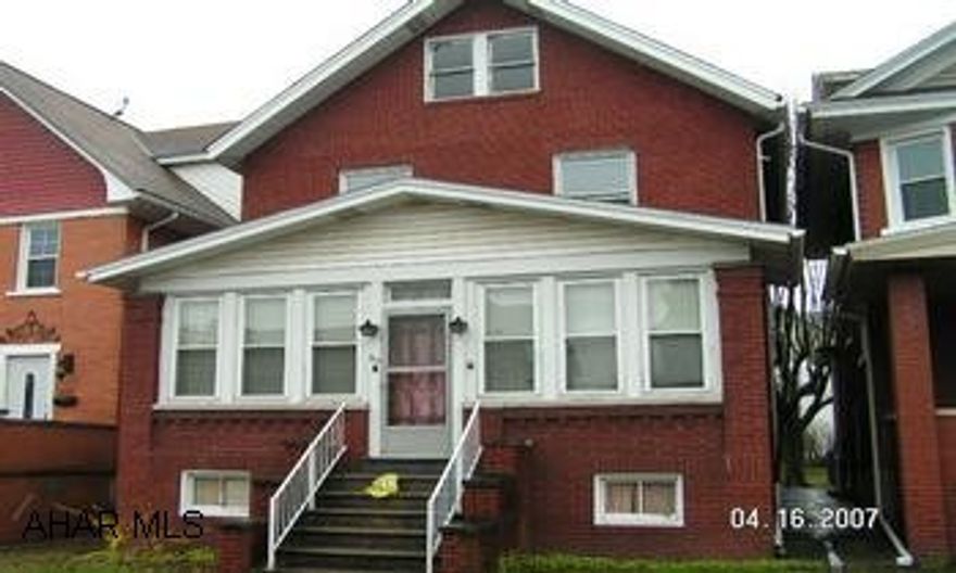 Large brick house, with many possibilities Brick exterior, enclosed, heated, front porch. 3 Br, w/ small office/computer rm. Garage in alley way.