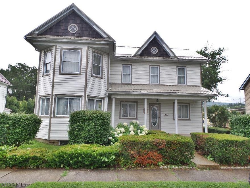 Beautiful Bellwood Borough home with new metal roof, vinyl siding, central air, public water & sewer, double lot.  The home features a new 1st floor 3/4 bath and laundry facility.  2 car garage, 2 side patios,