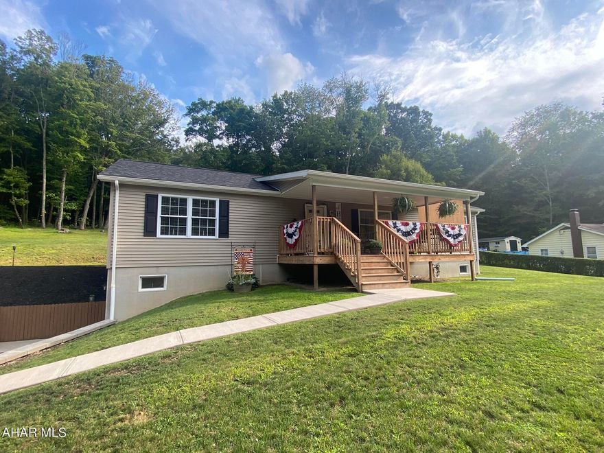 Completely move in ready ranch home on just over a half an acre. Property is a 2018 modular home (not mobile) and is still under warranty! Home features 3 bedrooms and 2.5 baths. Open floor plan with dining room, living room and custom kitchen with beautiful hickory cabinets! Kitchen is equipped with special features and tons of storage, island even has it's own USB ports for your convenience. Laundry room on main floor with matching hickory cabinetry. Master bedroom has large closet and en-suite bath. En-suite features a walk-in tile shower and double sinks. Basement is ready to be finished and already has a half bath in place and French-door walk out. Home is also wired for a generator. Free trash pickup in Broad Top township! Set up your showing for this awesome home today.