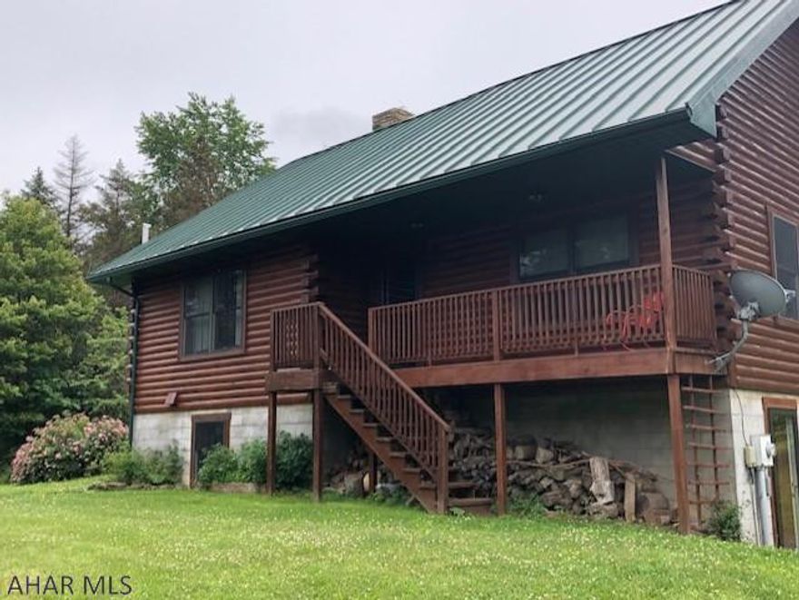 Gorgeous custom built 1  story log home.  Three bedrooms, 1 bath, with a large loft.  Plank flooring, Cherry cabinets, new deck, new shed, integral garage.  Full basement plumbed for future bath. Very secluded on 26.66 acres.  Large pond.  Close to Bedford.  Hunter's paradise.