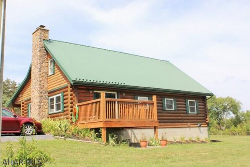 Beautiful engineered log home with open floor plan built in 2006 on a private parcel in the Chestnut Ridge School District.  2BD, 2BA with a bonus room upstairs!  Seated on 6.311 acres give you space to enjoy a dip in the pool or appreciate the perennial landscaping.  There is a three stall stable with cemented floors and stall mats, tack room and wash stall.  Also round pen and riding arena along with fenced pasture.  This property is horse ready with so much to offer.  Must see!