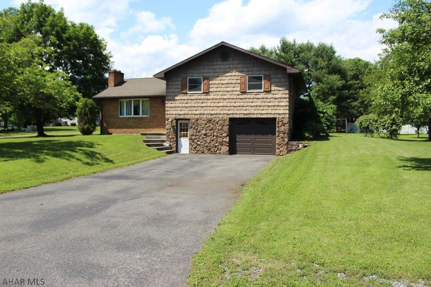 Charm at its best.  This well maintained, low maintenance home is in a great neighborhood of Hyndman.  Large corner lot with fruit trees and mature trees. Back Patio off the kitchen and dining room.  Open concept living area with 3 large bedrooms and a Bonus room on lower level. Large 1 car garage with a work area or additional storage for lawn equipment. Roof, gutters, soffit and fascia, vinyl siding, shutters, and pine ceilings all done 5 years ago. The central air and full bath were updated in last 10 years. Comes with Home Warranty.