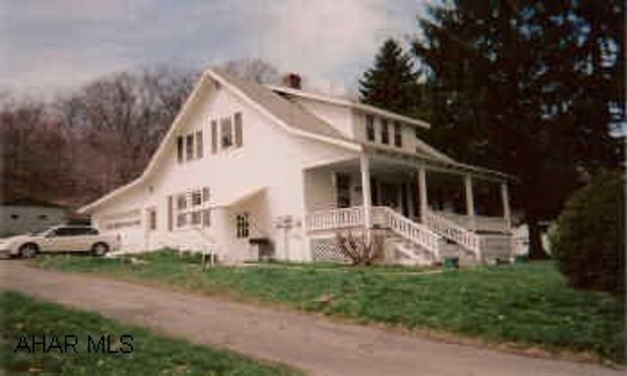 1.5 Story ;frame house, full basement, attached 1-car garage. 3BR, 1 full, 1 half and 1 3/4 baths. Situated on 1.43 partially wooded acres. Beautiful hardwood floors and trim throughout, 26x30 block garage with electric.